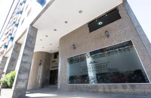 a building with a sign on the front of it at Monte Serrat Hotel in Santos