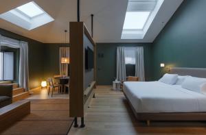 Łóżko lub łóżka w pokoju w obiekcie Hotel Arbaso