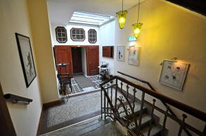 a view of a hallway with a staircase in a building at Hotel Reuter in Haiger