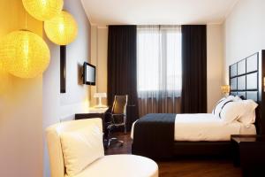 Uma cama ou camas num quarto em Holiday Inn Genoa City by IHG