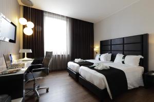 Uma cama ou camas num quarto em Holiday Inn Genoa City by IHG