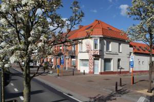 a street with buildings on the side of the road at oyenkerke-loft in De Panne