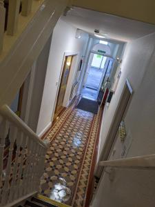 an overhead view of a hallway with a stairway at YHA Cheddar in Cheddar