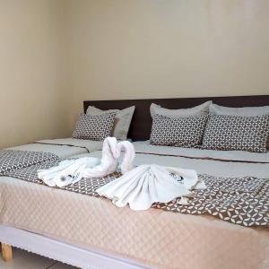 Ein Bett oder Betten in einem Zimmer der Unterkunft Hotel Brisa do Aracati
