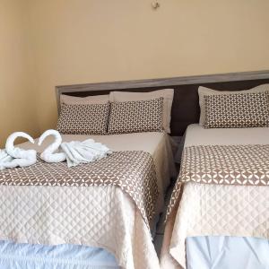 A bed or beds in a room at Hotel Brisa do Aracati