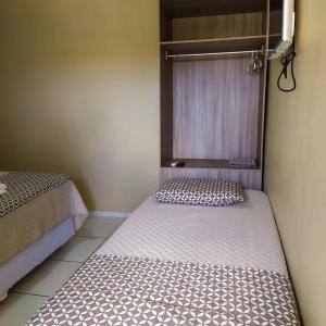 Łóżko lub łóżka w pokoju w obiekcie Hotel Brisa do Aracati