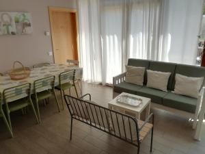 a living room with a couch and a table at Casa Carlota in Cabó