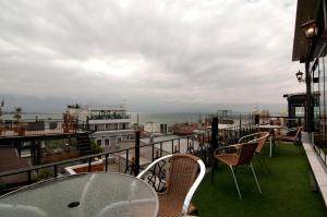 A balcony or terrace at Grand Ambiance Hotel