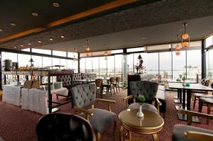 A restaurant or other place to eat at Grand Ambiance Hotel