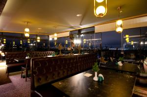 A restaurant or other place to eat at Grand Ambiance Hotel
