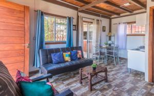 a living room with a couch and a table at Las yolandas in La Paloma