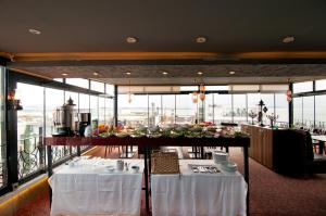 A restaurant or other place to eat at Grand Ambiance Hotel