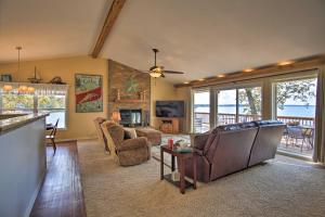 a living room with a view of the ocean at Grand Lake Waterfront Home with Shared Boat Ramp! in Grove