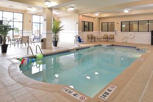 a pool in the middle of a hotel at Holiday Inn Montgomery South Airport, an IHG Hotel in Hope Hull