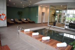 a lobby with a hot tub in a building at Holiday Inn - Lima Airport by IHG in Lima