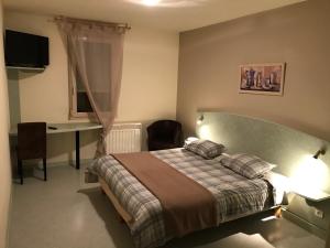 Postel nebo postele na pokoji v ubytování Abel Hôtel