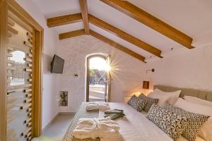 Posteľ alebo postele v izbe v ubytovaní Vista Del Porto Luxury Suites