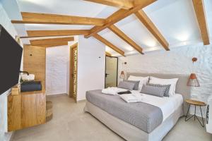 Posteľ alebo postele v izbe v ubytovaní Vista Del Porto Luxury Suites