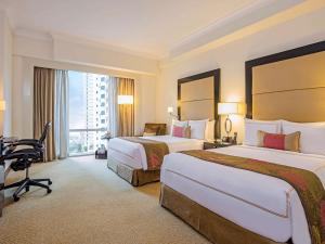 Postel nebo postele na pokoji v ubytování Fairmont Makati