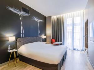 Un ou plusieurs lits dans un hébergement de l'établissement Ibis Styles Toulouse Capitole