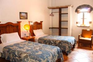 Postel nebo postele na pokoji v ubytování Hacienda Maria Elena + 37 fotografií