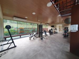 a gym with several treadmills and machines in a room at Nannai - Muro Alto - Alto Padrão in Porto De Galinhas