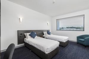 Thornton Executive Hotel客房内的一张或多张床位