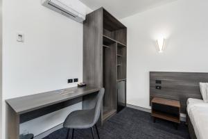 Thornton Executive Hotel客房内的一张或多张床位