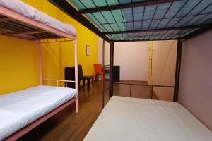 Afbeelding uit fotogalerij van SPOT ON 90119 Bed's Guesthouse in Kuching