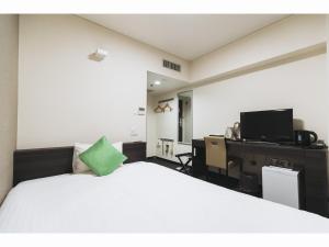 Llit o llits en una habitació de Cityroute Hotel