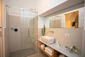 a bathroom with a sink and a shower at Bellamania B&B in Anacapri