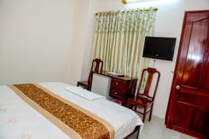 Thai Duong Hotel tesisinde bir odada yatak veya yataklar