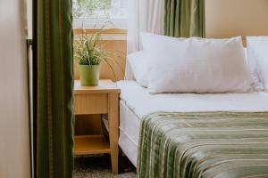 Postel nebo postele na pokoji v ubytování Hotel Vita
