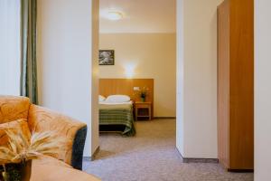 Postel nebo postele na pokoji v ubytování Hotel Vita