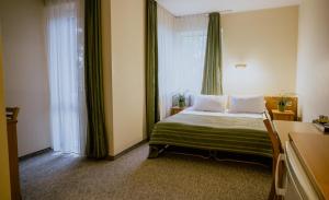 Postel nebo postele na pokoji v ubytování Hotel Vita