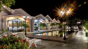 a swimming pool in a resort at night at Sandy Clay Bungalows in Sihanoukville