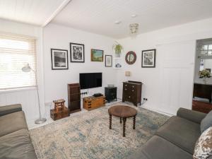 TV a/nebo společenská místnost v ubytování Driftwood + 4 fotografie