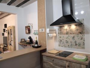 A kitchen or kitchenette at La Casita de Nerea 2 Párking Gratuito