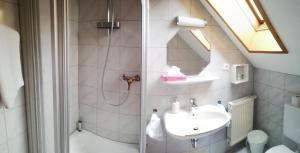 a bathroom with a shower and a sink at Gaststätte Liebl in Wiesent