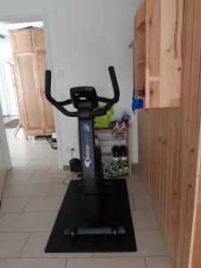 a exercise bike sitting on a floor in a room at Ferienwohnung Würzburg in Würzburg