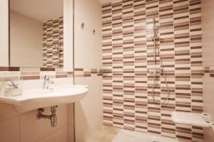 Een badkamer bij Invisa Hotel Club Cala Blanca