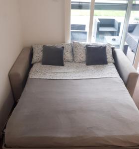 A bed or beds in a room at Apartment Bruneck Central