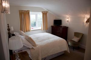 Postel nebo postele na pokoji v ubytování Amberley Inn