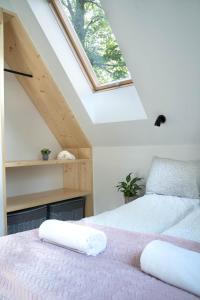 a bedroom with two beds in a attic at Dziadek Władek in Zakopane