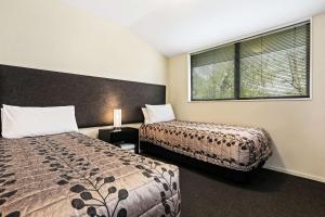 Postel nebo postele na pokoji v ubytování Quality Suites Amore