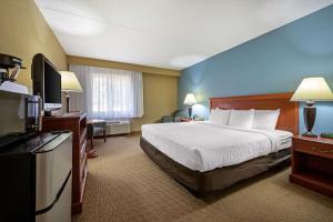 
a hotel room with two beds and a television at Clarion Hotel Lexington in Lexington
