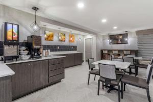 a dining room with a table and some chairs at Comfort Inn Nashville - Opryland Area in Nashville