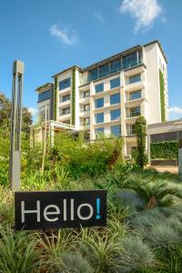 a halo sign in front of a building at The Social House Nairobi, a Preferred Lifestyle Hotel in Nairobi