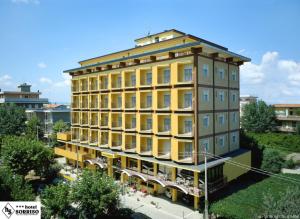 a rendering of a building with yellow at Hotel Sorriso in Bellaria-Igea Marina
