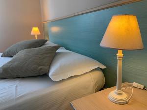 A bed or beds in a room at Villa Ai Colli